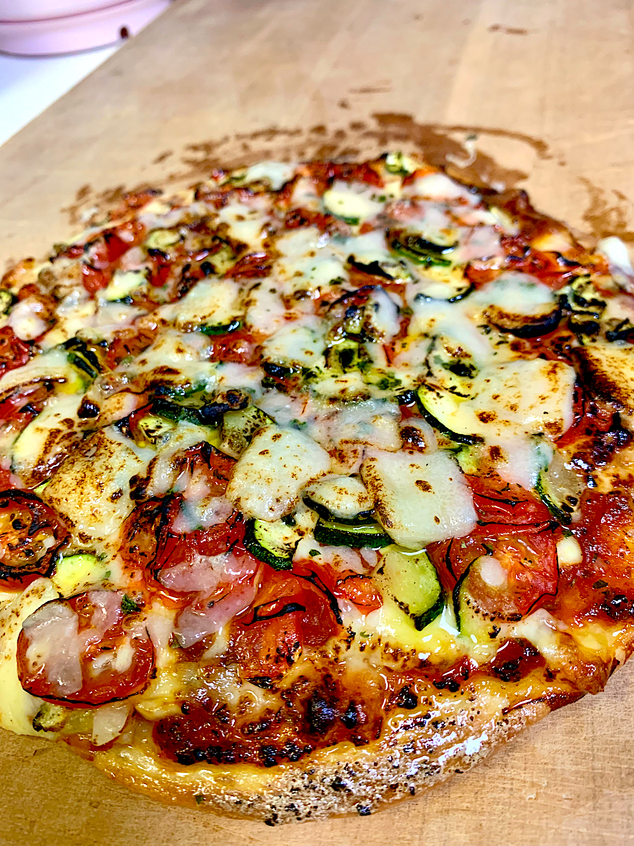 Sourdough Pizza Topped With Herbed Tomato, Zucchini & Grana Padano Cheese