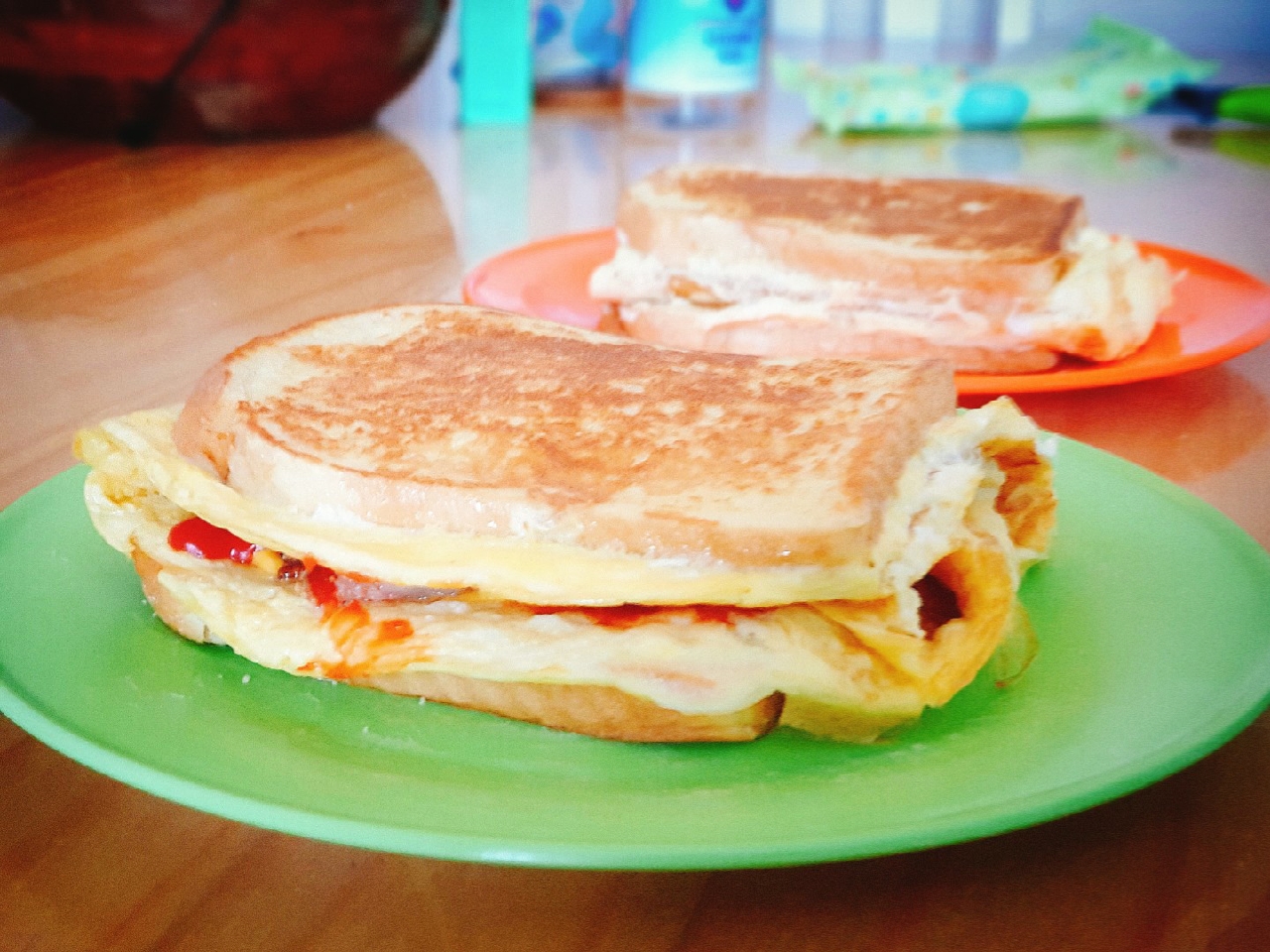 Egg toast with mozzarella cheese, bacon and sauce.